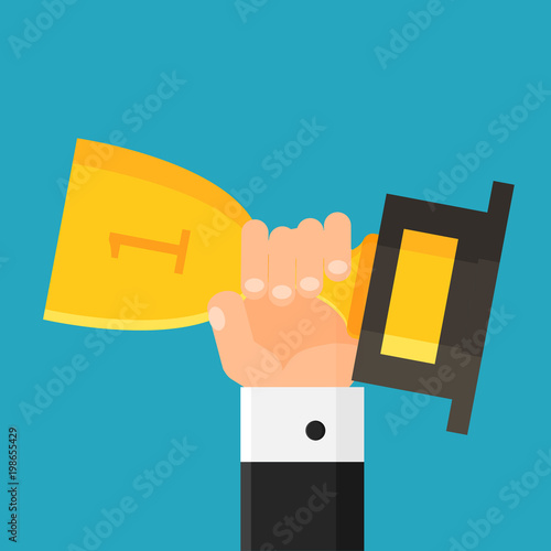 Hand holding trophy. Winner. Businessman with gold cup. Award. First place. Flat style. Vector illustration