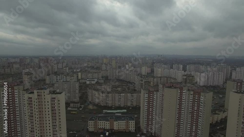 Aerial drone footage of gray dystopian urban area with identical houses