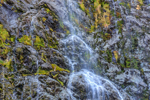 A closeup of a small waterfall along the Routeburn Track in New Zealand.