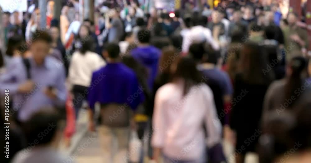 Blur view of people walking in the street at night Blur view of people walking in the street at night