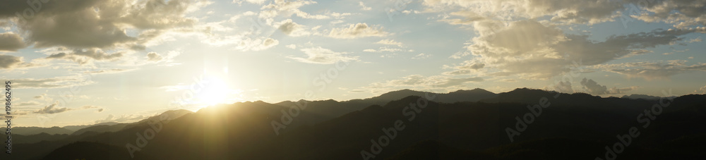 Amazing wild nature view of layer of mountain forest landscape with cloudy sky when sunset or twilight. Natural green scenery of cloud and mountain slopes background. Maehongson,Thailand Amazing wild nature view of layer of mountain forest landscape with cloudy sky when sunset or twilight. Natural green scenery of cloud and mountain slopes background. Maehongson,Thailand