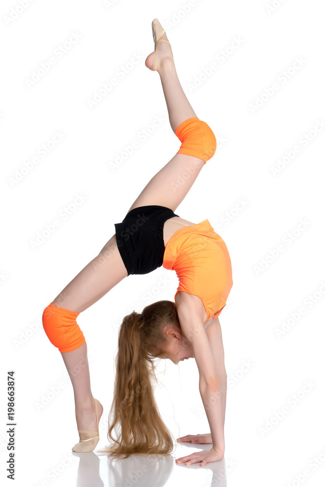 The gymnast performs a bridge with a raised leg. The gymnast performs a bridge with a raised leg.
