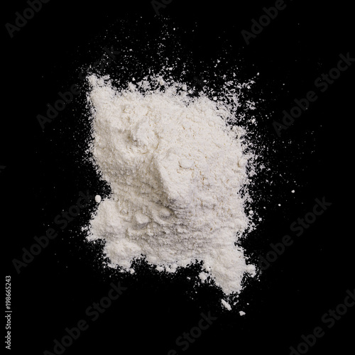 wheat flour pile on black background