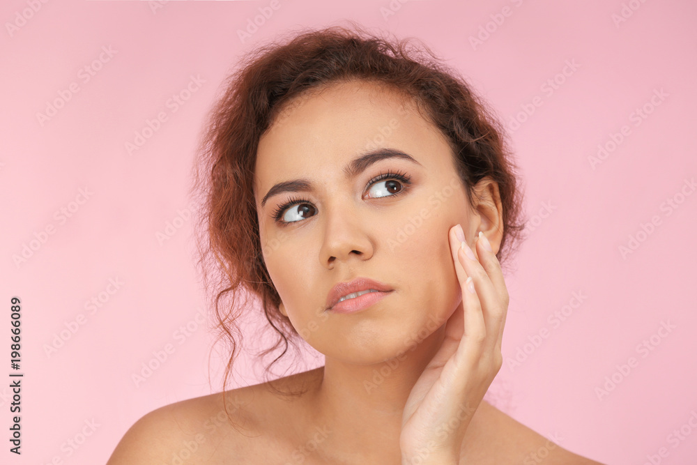 Beautiful young woman with acne problem on color background Beautiful young woman with acne problem on color background