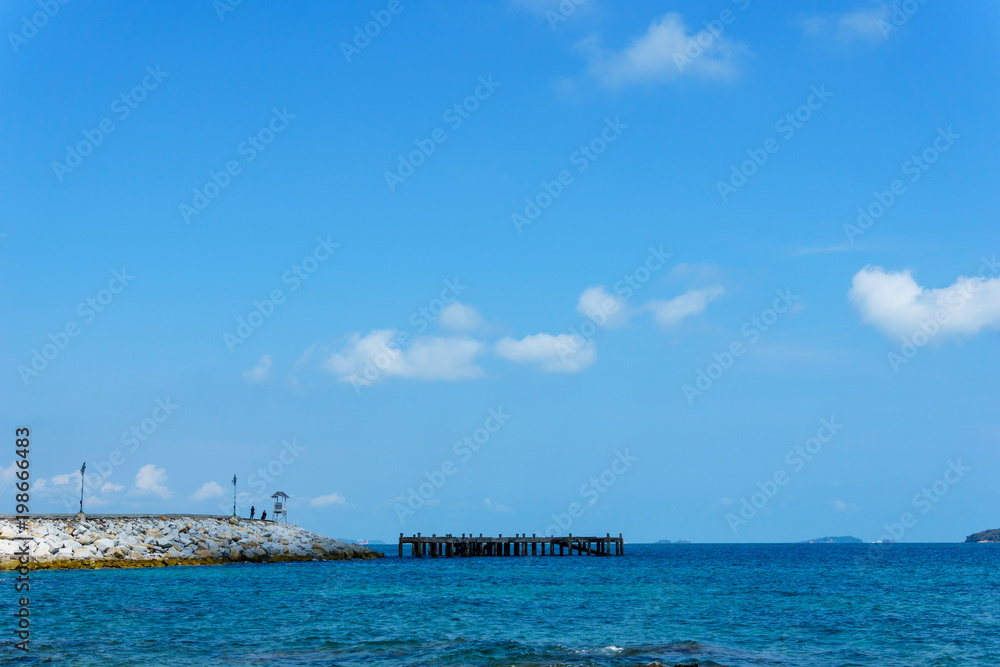 landscape panorama view of ocean blue sea with blue sky and little cloud and rock peir in the sea. landscape panorama view of ocean blue sea with blue sky and little cloud and rock peir in the sea.