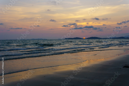 panorama landscape view of seascape and skyline with sun over the sea between the island and amazing twilight in the evening. © yanadhorn