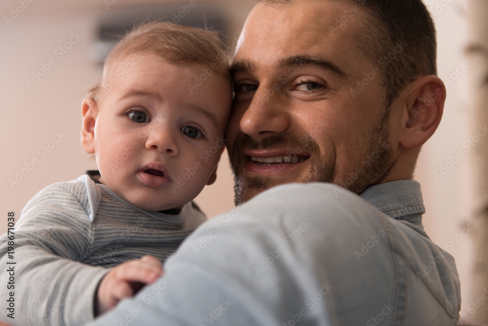 Father in Living Room With Baby Smiling Father in Living Room With Baby Smiling