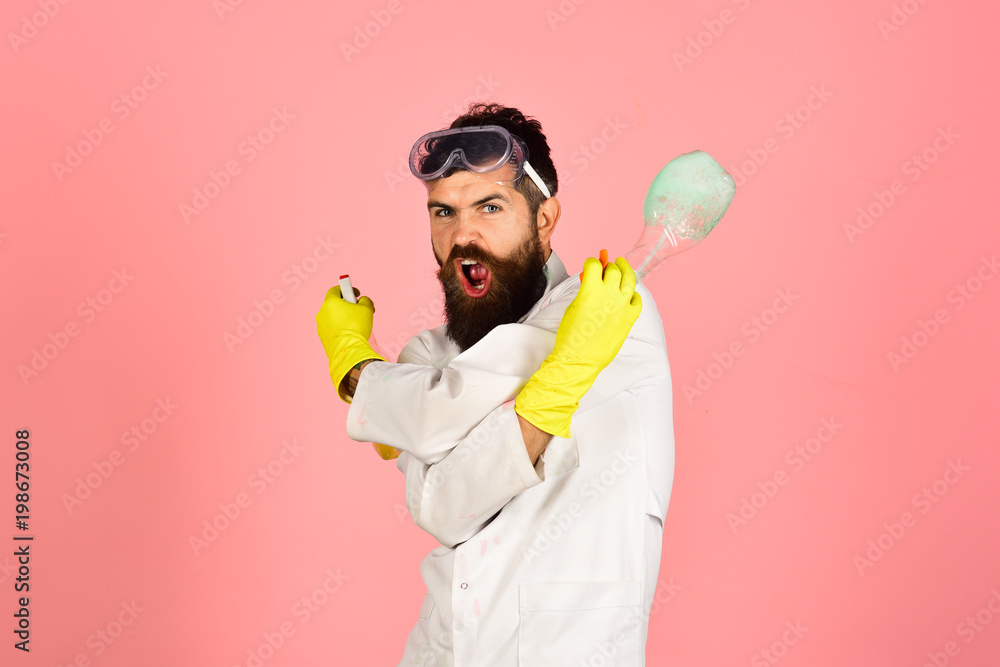 © Svitlana - Cleaning, cleaning service, housekeeping concept - angry bearded man in uniform and rubber gloves holds cleanser spray. Effective cleaning means. Copy space for advertise detergents, cleaning service. © Svitlana - Cleaning, cleaning service, housekeeping concept - angry bearded man in uniform and rubber gloves holds cleanser spray. Effective cleaning means. Copy space for advertise detergents, cleaning service.