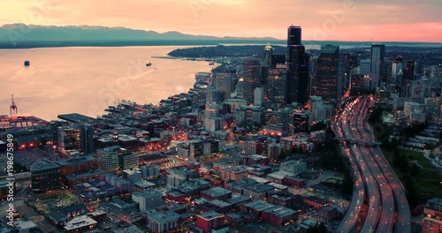 Seattle Washington Aerial Above Highway Lanes Traffic Skyline Waterfront Cityscape Orange Sky Sunset Lighting Dusk