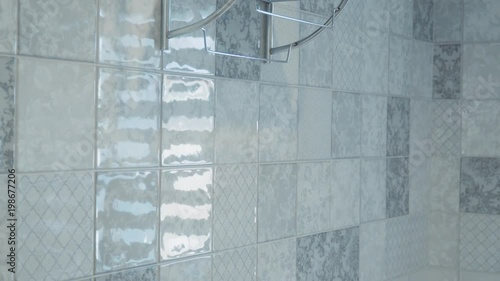 A woman's hand takes the towel. the white towel weighs on the dryer photo