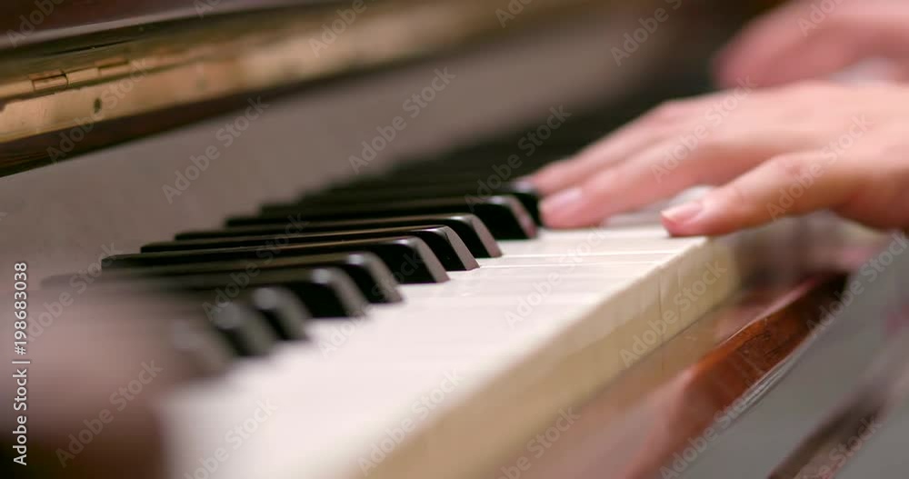 Man practicing piano at home Man practicing piano at home