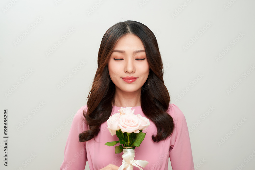Beautiful asian girl with flowers. Perfect skin. Beautiful asian girl with flowers. Perfect skin.