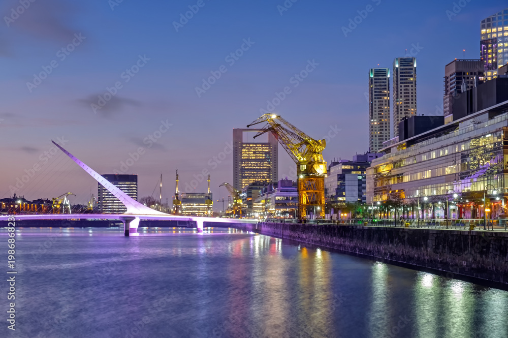 Φωτογραφία Puerto Madero and the Puente de la mujer in Buenos Aires, Argentina, after sunse