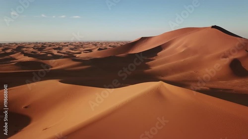 Aerial view on big sand dunes in Sahara desert at sunrise, Africa, 4k
 photo
