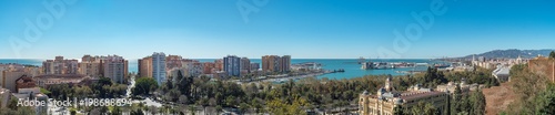 Malaga, Spain. Circa March 2018. Panorama view of the port, lighthouse,the city park,the bullfight ring, marina and city hall of Malaga on a sunny day. © elroce