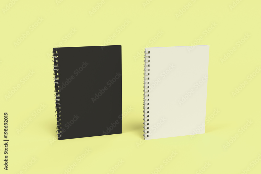 Two notebooks with spiral bound on yellow background Two notebooks with spiral bound on yellow background