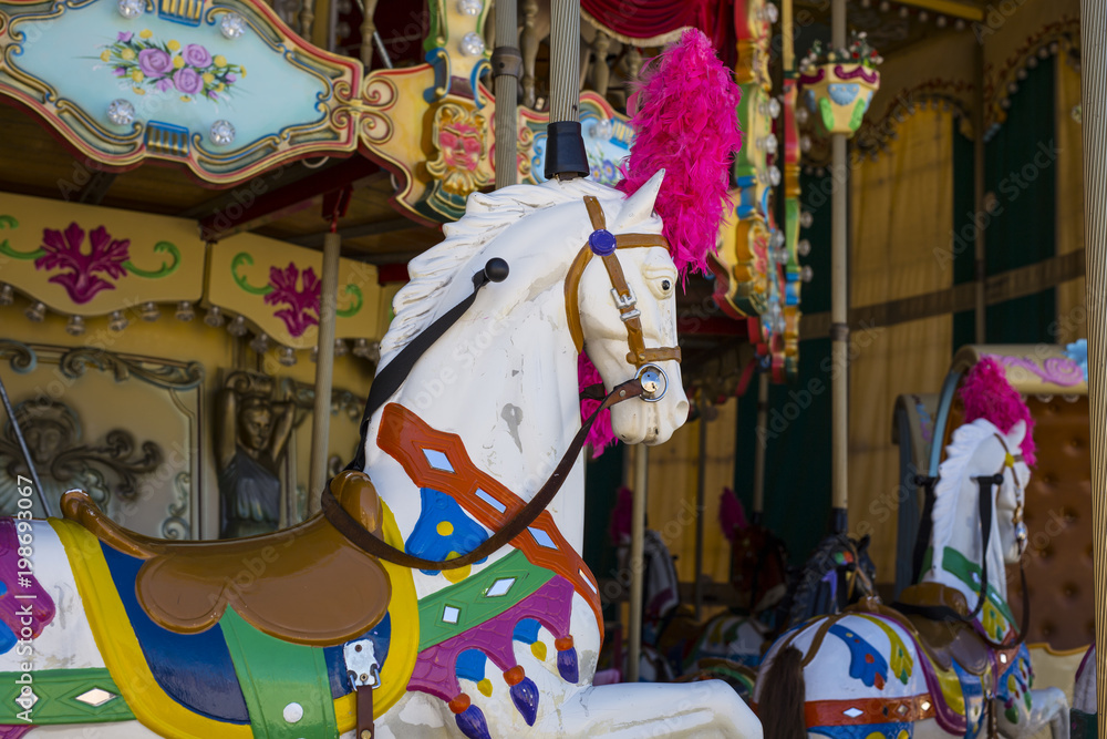detail of an ancient carousel horse with many colors