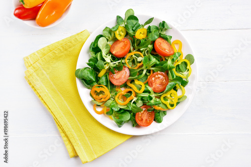 Vegetable salad from tomato, bell pepper, corn salad