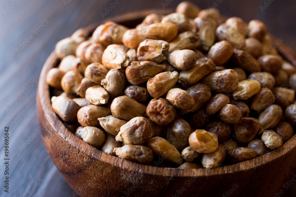 Turkish Snacks Kavurga / Fried Corn Seeds in Wooden Bowl. Turkish Snacks Kavurga / Fried Corn Seeds in Wooden Bowl.