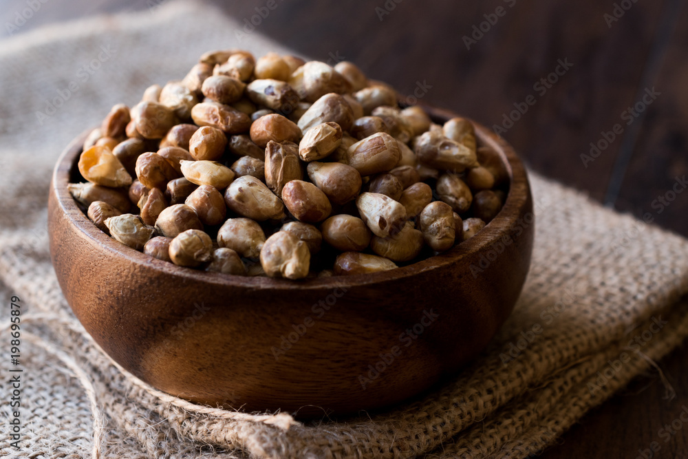 Turkish Snacks Kavurga / Fried Corn Seeds in Wooden Bowl. Turkish Snacks Kavurga / Fried Corn Seeds in Wooden Bowl.