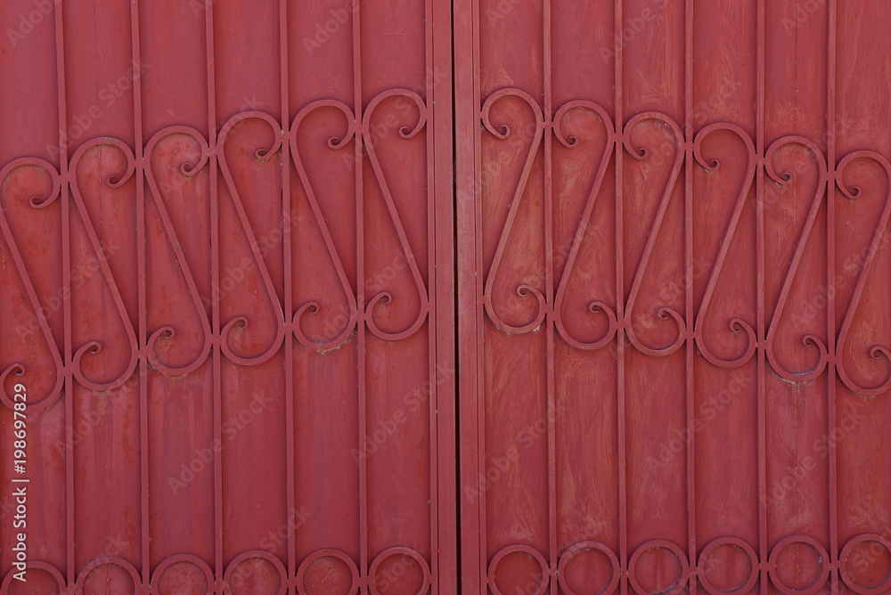 iron background from a steel forged pattern on a red metal fence Stock ...