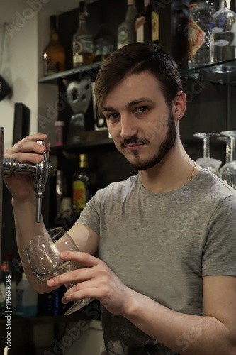 waiter serving beer in the pub