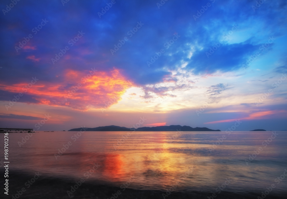 The colorful sunset cloud at the evening beach.