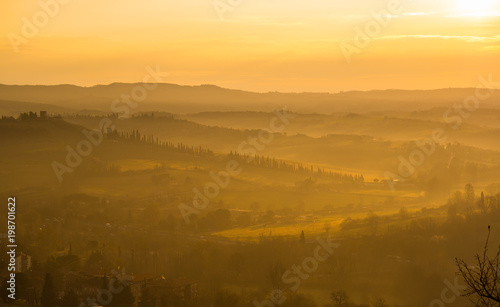 Wallpaper Mural Sunrise in the lands of Tuscany. Warm colors on the hills and haze Torontodigital.ca