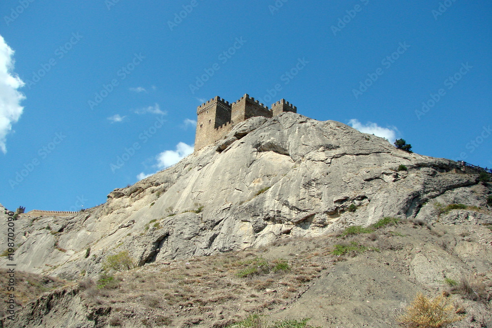 View of the walls of the ancient Greek fortress on the top of a rock near the Black Sea town of Sudak.