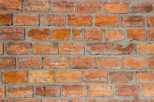 Background from a brick wall. Brickwork made of red large brick.