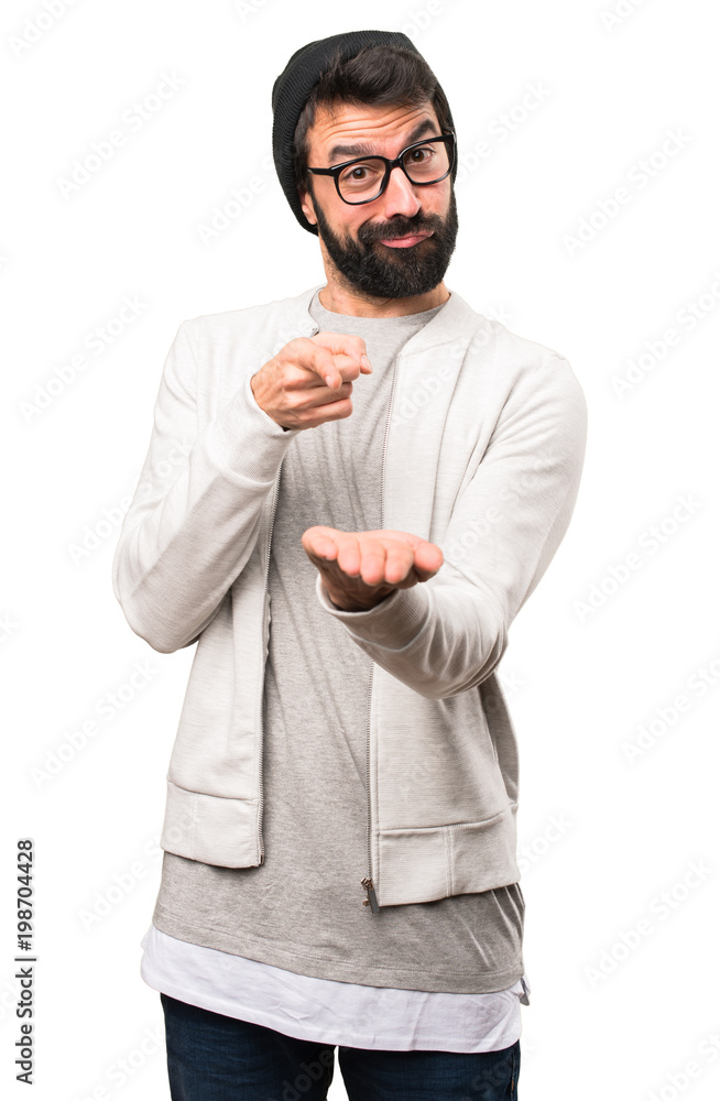 Hipster man holding something on white background Hipster man holding something on white background