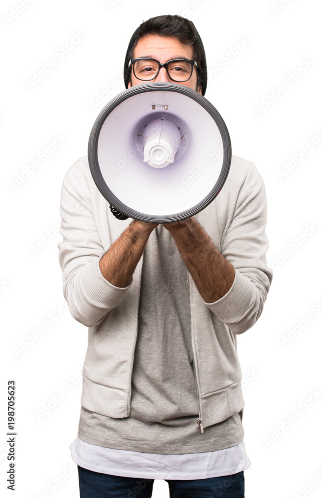Hipster man holding a megaphone on white background Hipster man holding a megaphone on white background
