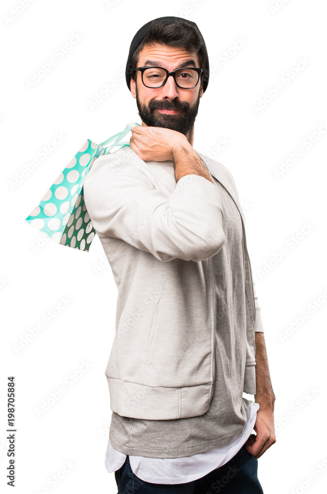 Hipster man with shopping bag on white background Hipster man with shopping bag on white background