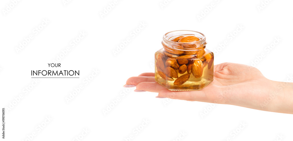 A honey jar with almonds nuts in hand pattern A honey jar with almonds nuts in hand pattern