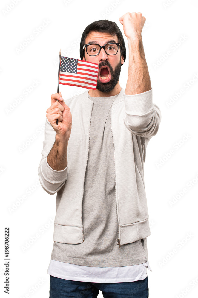 Happy Hipster man holding an american flag on white background