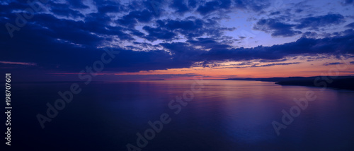 Spring sunset over Jurassic coast from St Alban's of St Adhelm's Head, Dorset, UK
