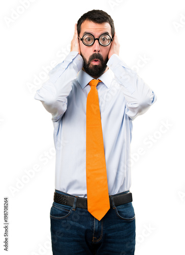 Funny man with glasses covering his ears