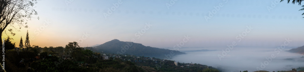 Panorama of mountain landscape with fog