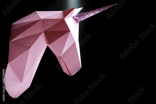 Pink unicorn on a black background. 3d model of a unicorn. Copy space