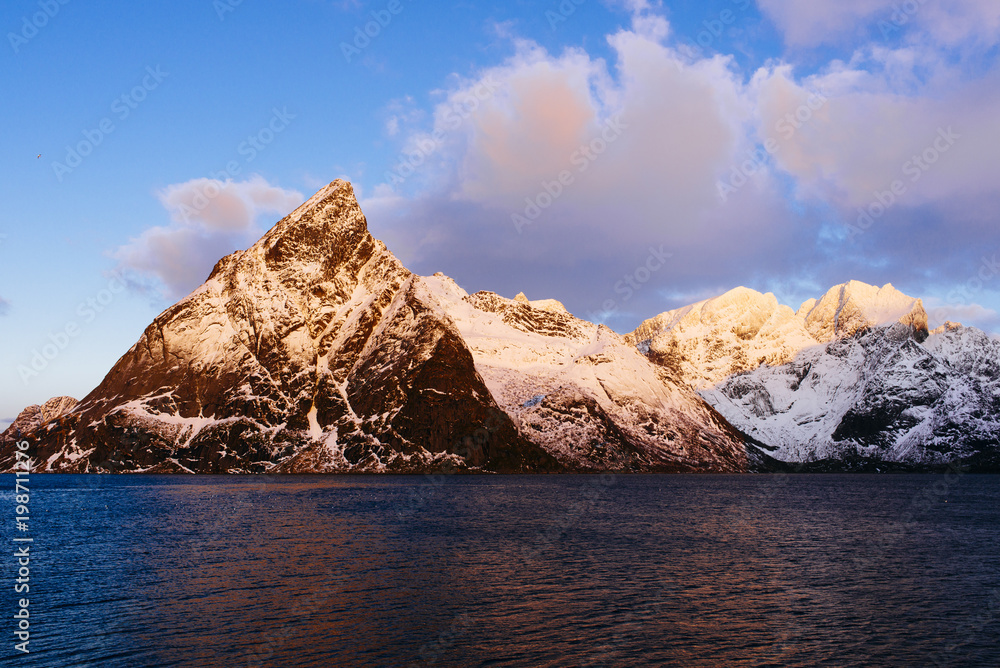 wild ragged mountain range in the winter time/ Olstinden/ Lofoten/ Norway/ Europe