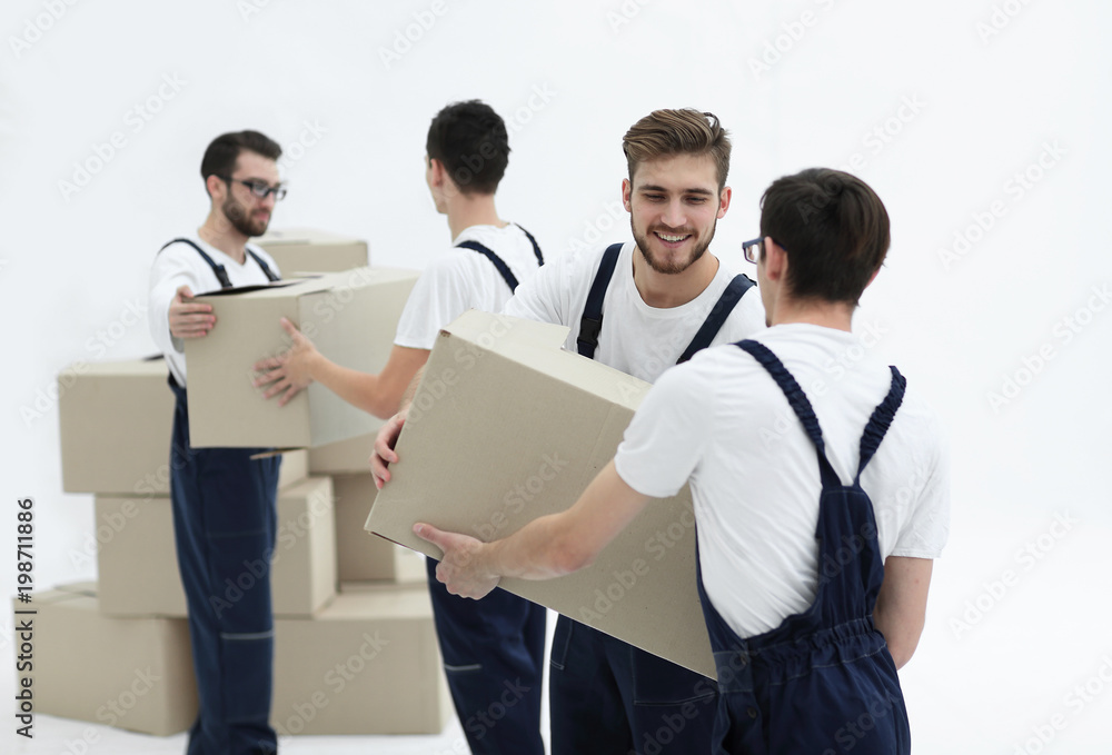 Portrait of movers holding box smiling isolated on white backgro Portrait of movers holding box smiling isolated on white backgro