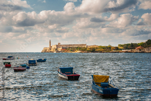 The Castillo Del Morro lighthouse in Havana. View from the waterfront Malecon on the water and boats. The old fortress Cuba