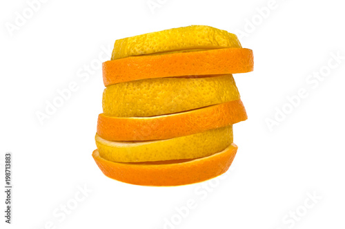 orange fruit and lemon are cut into slices on a white background