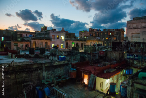 Night landscape. Top view of the street, on ordinary houses with roofs and balconies, where clothes dry. Havana. Cuba photo