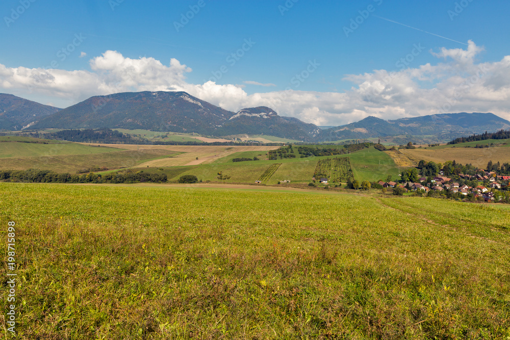 Summer hills landscape with Benusovce village in Slovakia.