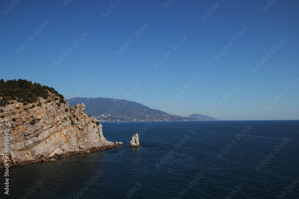 Naklejka premium View of the sea and the mountainous coast in the Crimea near the Swallow's Nest.