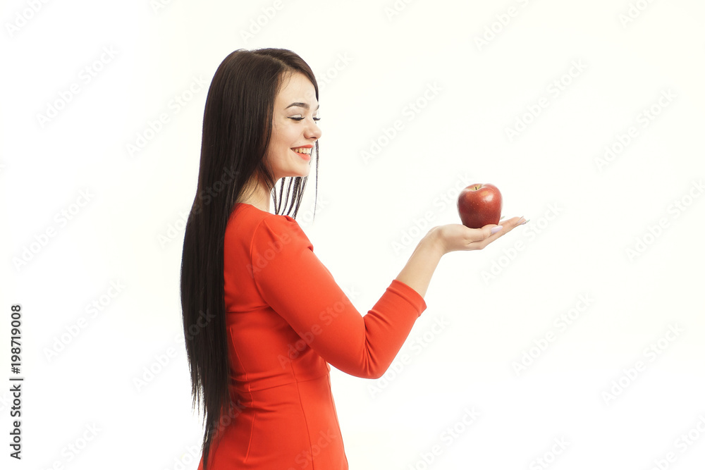 Beautiful young smiling woman holding an apple in her hands on a white background isolation Beautiful young smiling woman holding an apple in her hands on a white background isolation