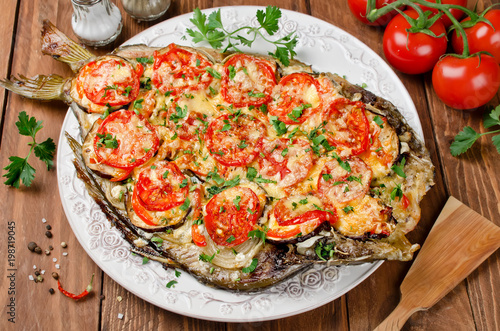 Grilled fish with vegetables and cheese
