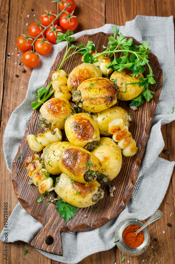 Grilled potatoes stuffed with bacon and herbs