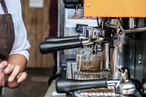 Cafe barista making coffee preparing machine